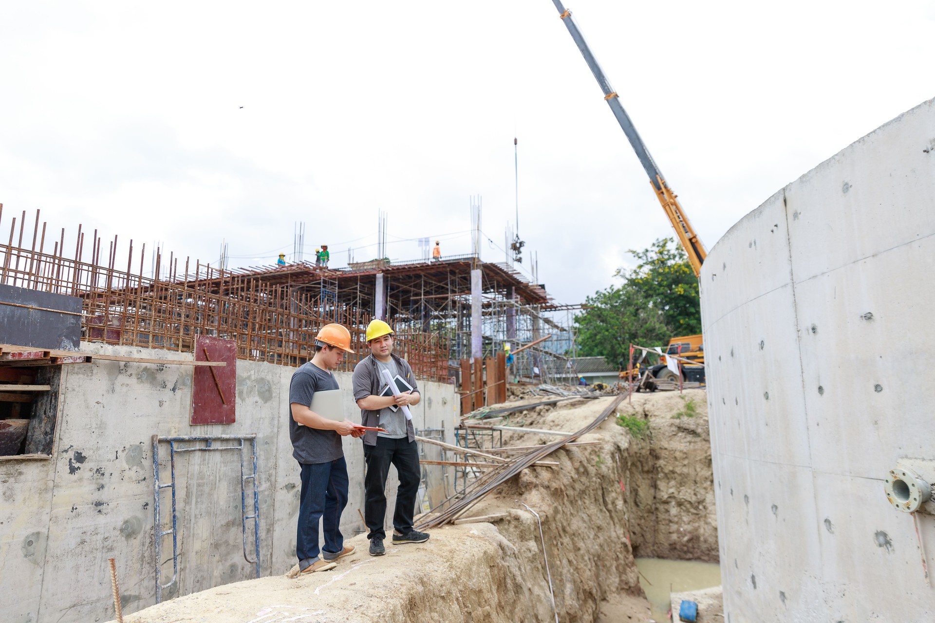 Engineer Wearing Hardhat Working At Construction Site