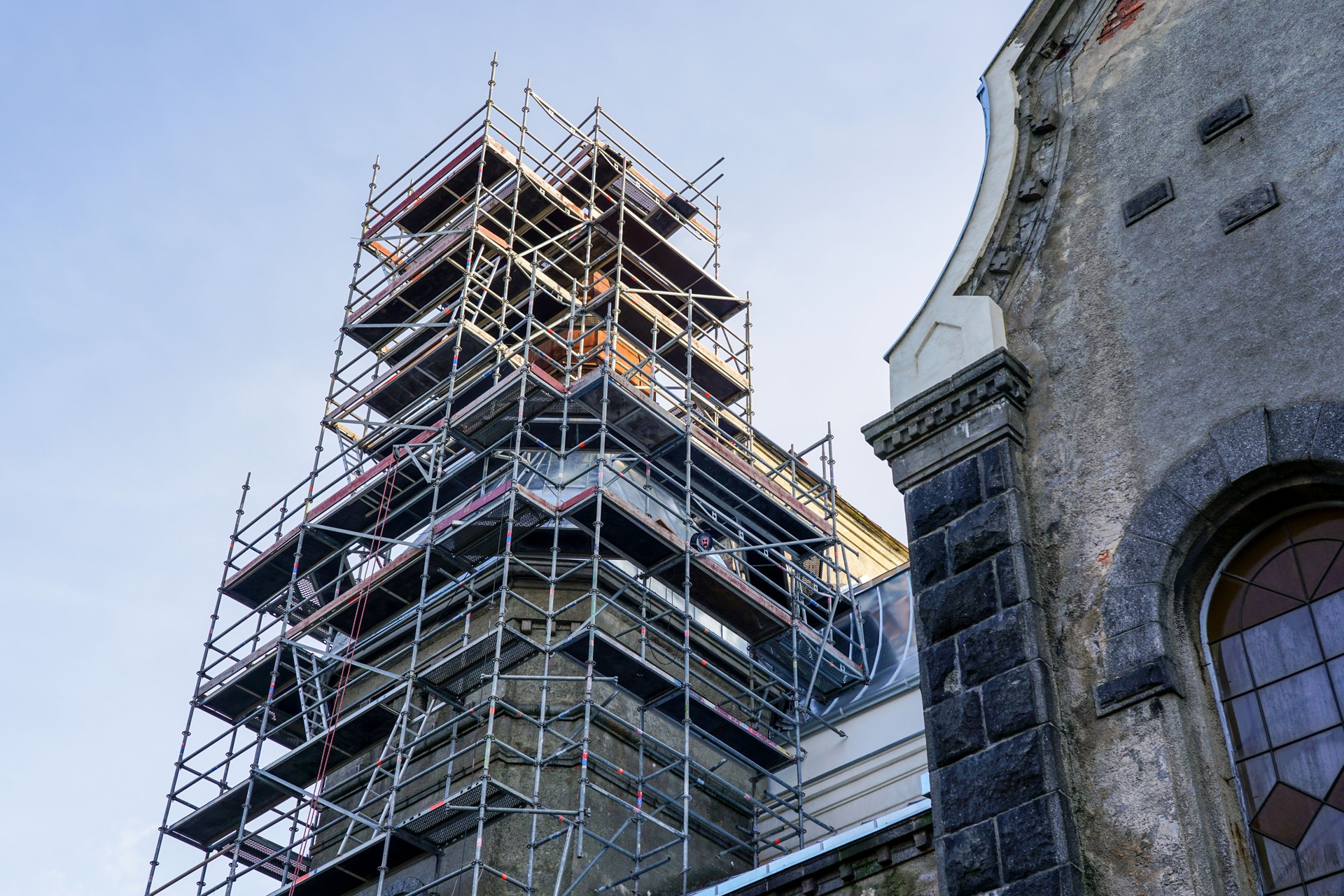 scaffolding of complex configuration for replacing the roof of a historic church tower